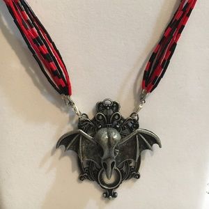 Bird skull and batwing necklace
